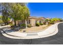 Beautiful view of a well-maintained home with landscaped grounds and mature trees at 145 Austin Rose Ave, Henderson, NV 89002
