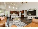 Open concept living space featuring high ceilings, large windows, and seamless transition to the kitchen at 145 Austin Rose Ave, Henderson, NV 89002