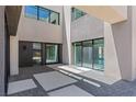 Stunning entrance featuring a combination of stone and concrete in geometric patterns at 1548 Pleasant Bay Ct, Henderson, NV 89011