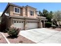 Spacious two-story home with a three-car garage and low-maintenance yard at 2112 Merganser Ct, North Las Vegas, NV 89084