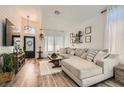 Bright living room with vaulted ceilings, wood-look floors, and stylish decor at 2470 Lower Meadows Ave, Henderson, NV 89052