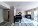 View of open living area with tile flooring, dining table, and comfortable seating arrangement at 2612 Sonora St, Las Vegas, NV 89102