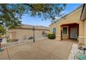 Spacious front yard showcasing desert landscaping, a covered porch, and mature trees at 2820 Goldcreek St, Henderson, NV 89052