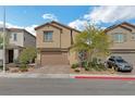 Inviting two-story home featuring a two-car garage, low maintenance front yard, and attractive landscaping at 2935 Gaffer Film St, Las Vegas, NV 89156