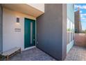 Inviting entryway with a modern door and stylish outdoor bench at 4294 Eagle Summit Ave, Las Vegas, NV 89141
