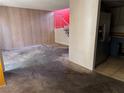 View of living room with staircase and access to kitchen featuring updated appliances at 4338 Caliente St # 8, Las Vegas, NV 89119