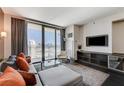 Open living space with comfortable seating, entertainment center, and city views at 4381 W Flamingo Rd # 3206, Las Vegas, NV 89103
