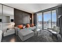 Comfortable living room with plush seating, balcony access, and panoramic city views at 4381 W Flamingo Rd # 3206, Las Vegas, NV 89103
