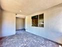 An empty, neutral-toned covered patio, featuring brick flooring and ample natural light at 483 Fairview Hills St, Las Vegas, NV 89138