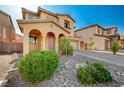 Charming home with a covered entrance, beautiful landscaping, and a welcoming front yard at 4937 Teal Petals St, North Las Vegas, NV 89081