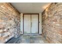 Inviting entryway with stone accents and double doors, creating a grand entrance at 4998 Schumann Dr, Las Vegas, NV 89146