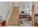Bright and airy staircase leading to the upper level, complemented by an open living space at 4998 Schumann Dr, Las Vegas, NV 89146