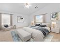 Serene bedroom with neutral tones, plush bedding, and ample natural light at 5396 Valley Wells Way, Las Vegas, NV 89113
