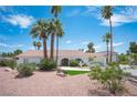 Lovely single-story home with a manicured lawn, mature palm trees, and a charming front garden at 5515 Coley Ave, Las Vegas, NV 89146