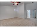 Cozy bedroom featuring neutral paint, plush carpet, and a ceiling fan at 6436 Point Break St, North Las Vegas, NV 89084