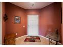 Inviting entryway features tile flooring, a vibrant wall color and tasteful decor at 6737 Divers Loons St, North Las Vegas, NV 89084