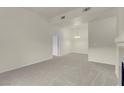 Spacious living room with neutral carpet, ceiling light and bright natural light at 8805 Jeffreys St # 2020, Las Vegas, NV 89123