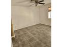 Cozy bedroom featuring tiled floors, ceiling fan, and a window for natural light at , Henderson, NV 89011