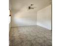 Spacious living room featuring tiled floors, ceiling fan, and ample natural light at , Henderson, NV 89011