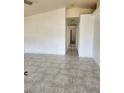 Bright living room with tiled floors, neutral walls and airy open space at , Henderson, NV 89011