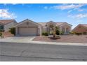 Inviting single-story home with a well-maintained desert landscape at 11032 Mission Lakes Ave, Las Vegas, NV 89134