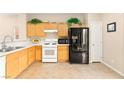 Functional kitchen with black appliances and plenty of cabinet storage at 11135 Abbeyfield Rose Dr, Henderson, NV 89052