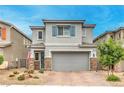 Charming two-story home with stone accents, a well-manicured yard, and a two-car garage at 1267 Dorado Sea Ct, Henderson, NV 89052