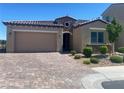 Charming single-story home with stone accents and a brick driveway at 138 Short Grass Ave, Las Vegas, NV 89148