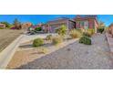 Attractive desert landscaping enhances the beauty of this residential home at 2613 Velodrome Ct, Henderson, NV 89044
