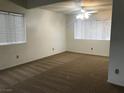 Sun-filled bedroom with neutral carpet and ceiling fan at 3138 White Rose Way, Henderson, NV 89014
