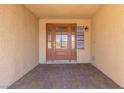 Covered front porch with tiled floor and beautiful front door at 326 Fuente Dr, Henderson, NV 89014