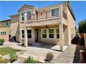 A fully fenced backyard with a covered patio, a balcony, and low-maintenance landscaping at 3624 Pelican Brief Ln, North Las Vegas, NV 89084