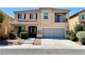 Two-story home featuring desert landscaping, a two car garage, and a small balcony at 3624 Pelican Brief Ln, North Las Vegas, NV 89084