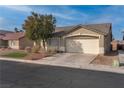 Charming single-story home with a two-car garage and a small, tidy front lawn at 3713 Nairobi Ln, North Las Vegas, NV 89032