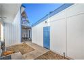 Image showing access to side entrance with white and blue trim at 4078 Gold Coast Dr, Las Vegas, NV 89121