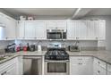 A bright kitchen featuring stainless steel appliances and granite countertops at 4078 Gold Coast Dr, Las Vegas, NV 89121