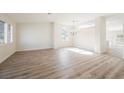 Bright, airy living room features beautiful wood floors, fresh paint, and lots of natural light at 4336 Fenton Ln, North Las Vegas, NV 89032