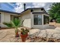 Charming single-story home showcasing a well-maintained yard and a concrete driveway with new exterior paint at 4387 Sun Vista Dr, Las Vegas, NV 89104