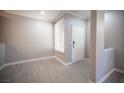 The bright entryway boasts a light-filled interior with wood-look flooring and a neutral color palette at 4400 S Jones Blvd # 2075, Las Vegas, NV 89103