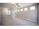 Bright living room showcasing modern flooring, natural light from windows, and a ceiling fan at 4400 S Jones Blvd # 2075, Las Vegas, NV 89103