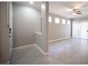 A bright living room is enhanced by natural light, with sleek wood floors and a ceiling fan at 4400 S Jones Blvd # 2075, Las Vegas, NV 89103