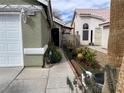 Beautiful home exterior with well-maintained landscaping and vibrant greenery at 4568 Little Finch Ln, Las Vegas, NV 89115