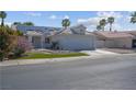 Inviting single-story home featuring solar panels, desert landscaping, and a two-car garage at 4644 Canna Dr, Las Vegas, NV 89122