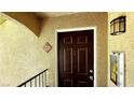 Close-up of the unit front door, showing the house number, door hardware, and porch light at 7885 W Flamingo Rd # 2003, Las Vegas, NV 89147