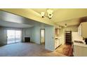 Open living space with fireplace, sliding glass doors, and seamless flow into the kitchen at 7885 W Flamingo Rd # 2003, Las Vegas, NV 89147