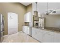 Bright kitchen with stainless appliances, granite counters, and a view to the living room at 8541 Highland View Ave, Las Vegas, NV 89145