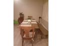 Bright dining area with wooden table and chairs plus bench seating and natural light at 1006 Cove Palisades Dr, North Las Vegas, NV 89031