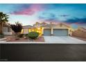 Charming single-story home with a well-maintained lawn, desert landscaping, and a spacious two-car garage at 10243 Cowboys Dream St, Las Vegas, NV 89131
