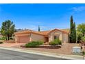 Attractive single-story house showcasing desert landscaping, a tile roof, and an attached two-car garage at 10636 Argents Hill Dr, Las Vegas, NV 89134