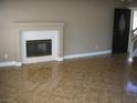 Living room featuring decorative fireplace and tile flooring at 1927 Raspberry Hill Rd, Las Vegas, NV 89142